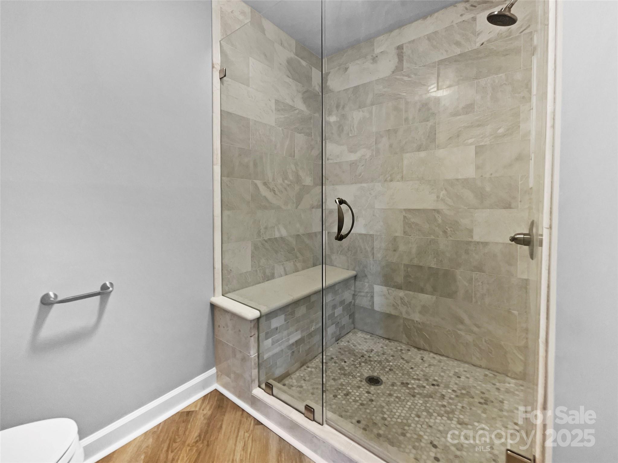 17931 Kings Point Drive, Unit G Cornelius, NC 28031 - Photo 13 of 20 a bathroom with a shower and toilet