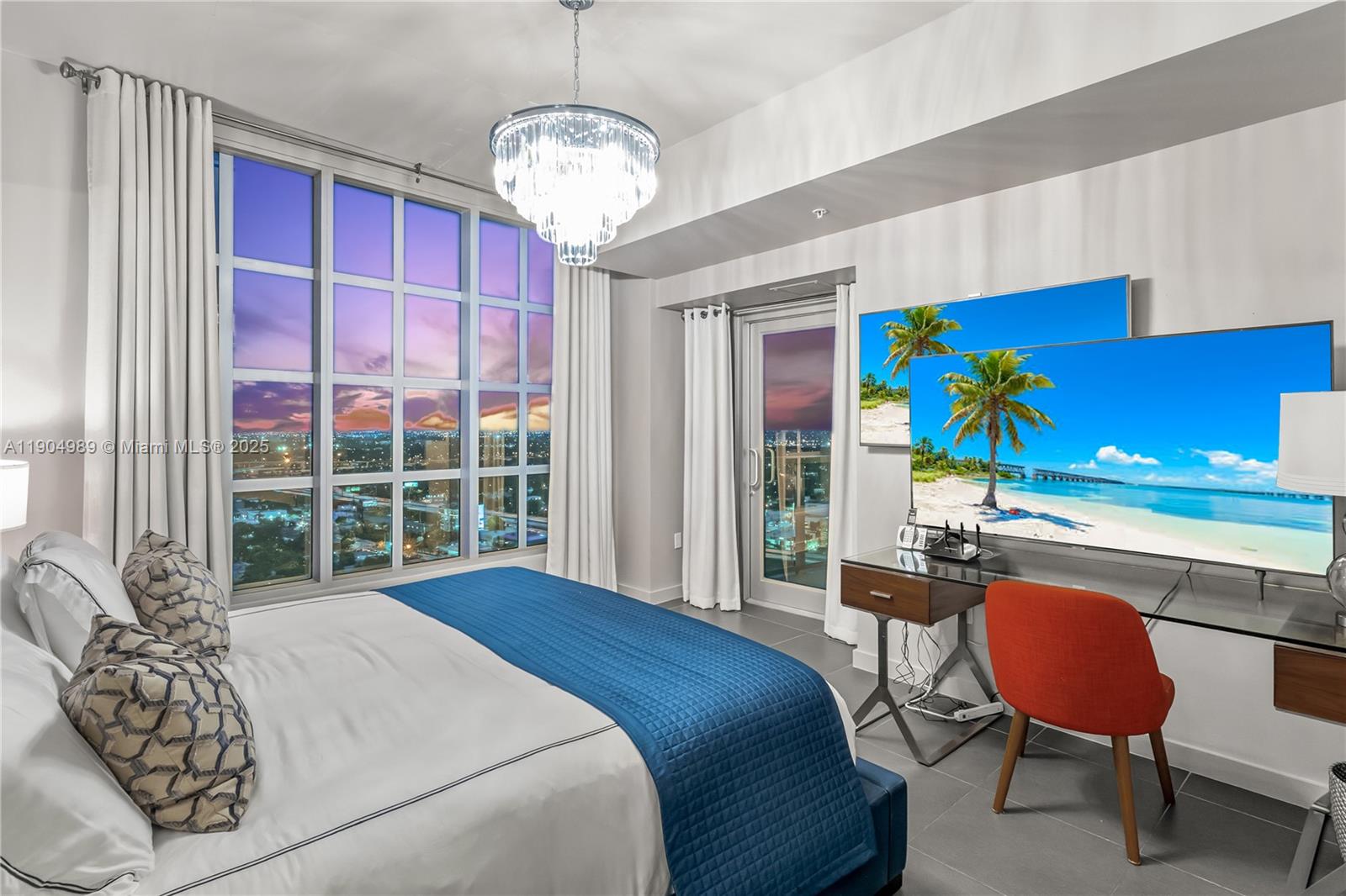 3301 Northeast 1st Avenue, Unit H2907 Miami, FL 33137 - Photo 12 of 29 a bedroom with a bed dresser and a window