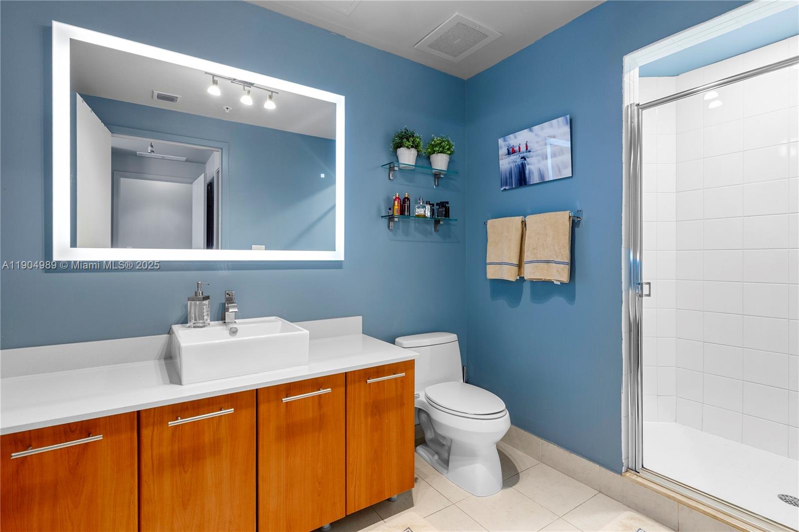 3301 Northeast 1st Avenue, Unit H2907 Miami, FL 33137 - Photo 13 of 29 a bathroom with a toilet sink and mirror