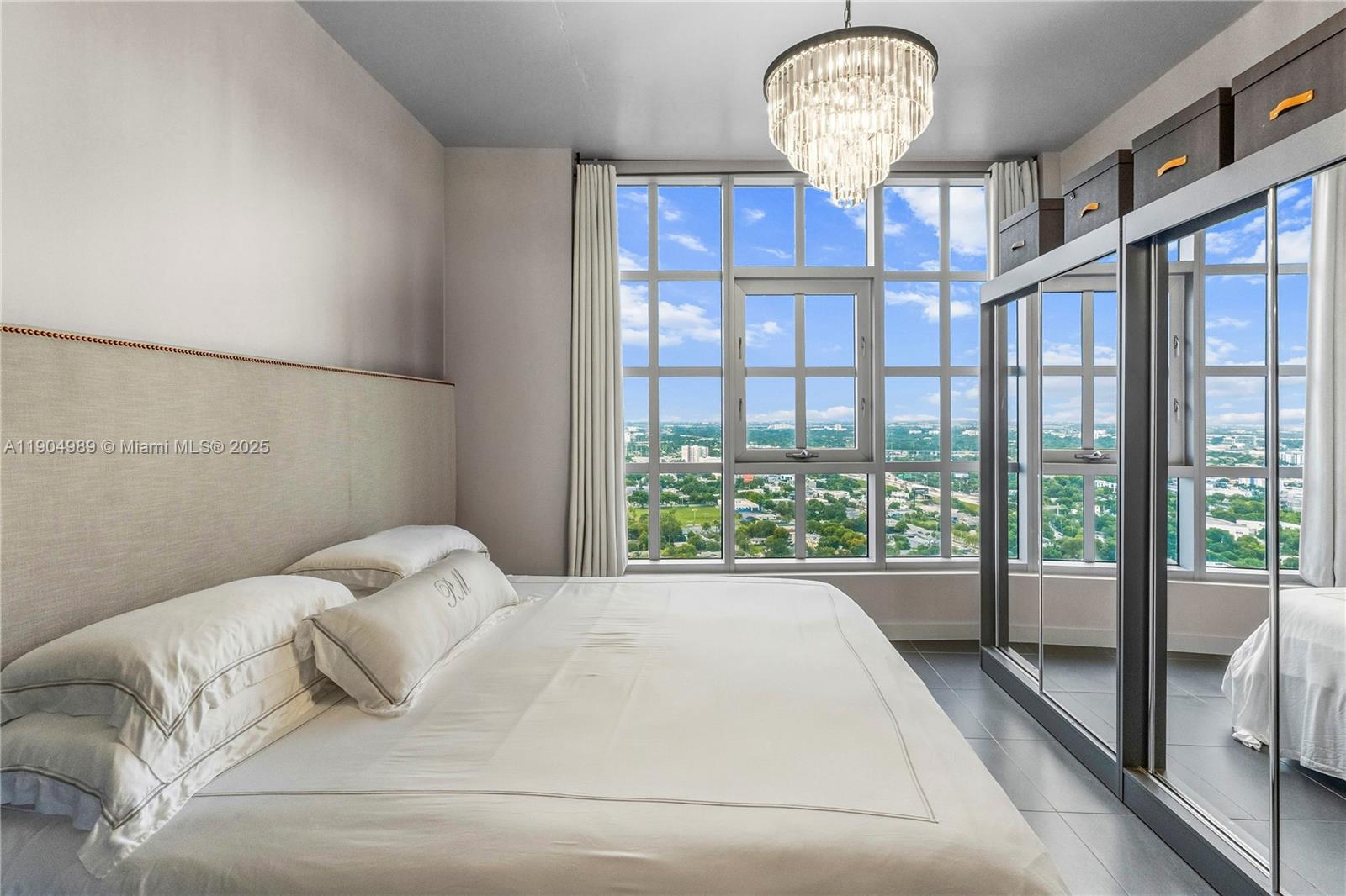 3301 Northeast 1st Avenue, Unit H2907 Miami, FL 33137 - Photo 15 of 29 a bedroom with a bed and a window