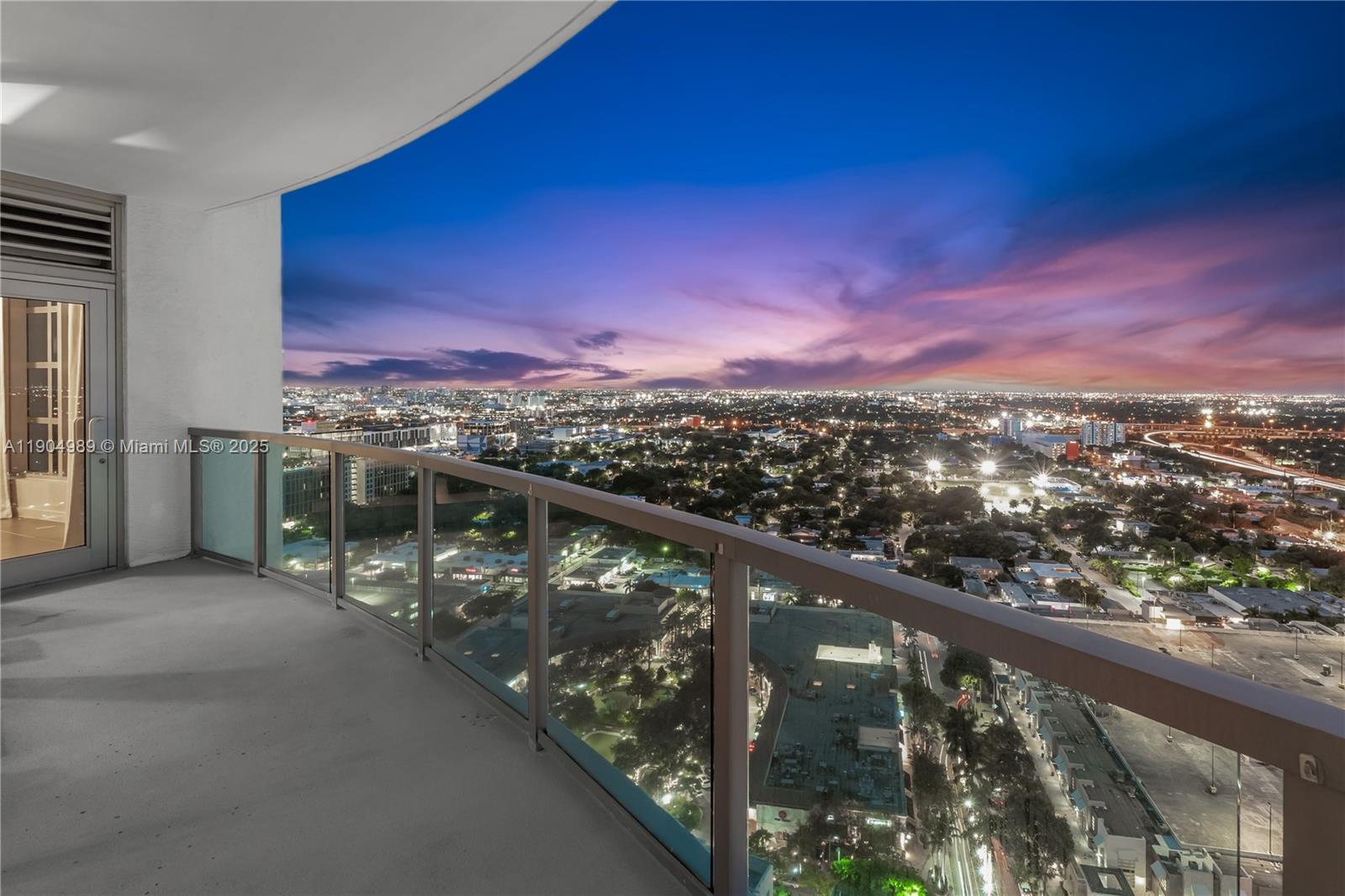 3301 Northeast 1st Avenue, Unit H2907 Miami, FL 33137 - Photo 17 of 29 a view of city and mountain from a balcony
