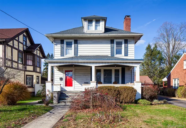 a front view of a house with yard