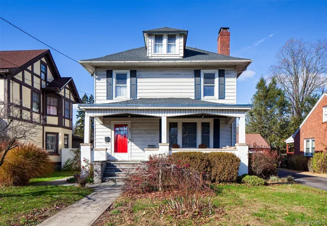 a front view of a house with yard