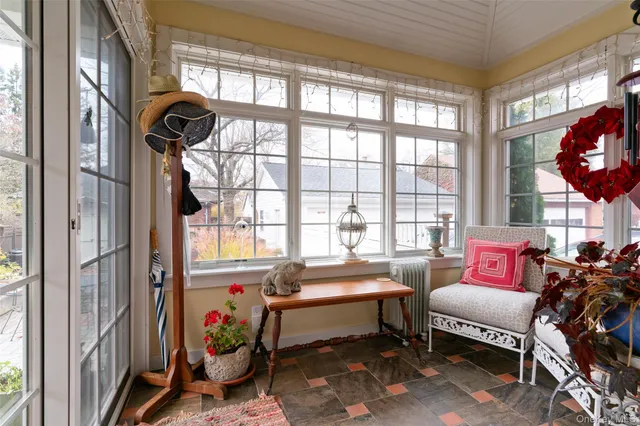 a bedroom with furniture and a window
