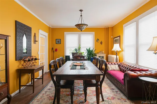 a dining room with a table and chairs