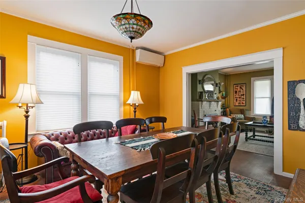 a view of a dining room with furniture and window