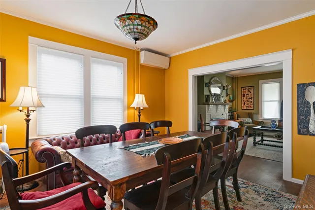 a view of a dining room with furniture and window