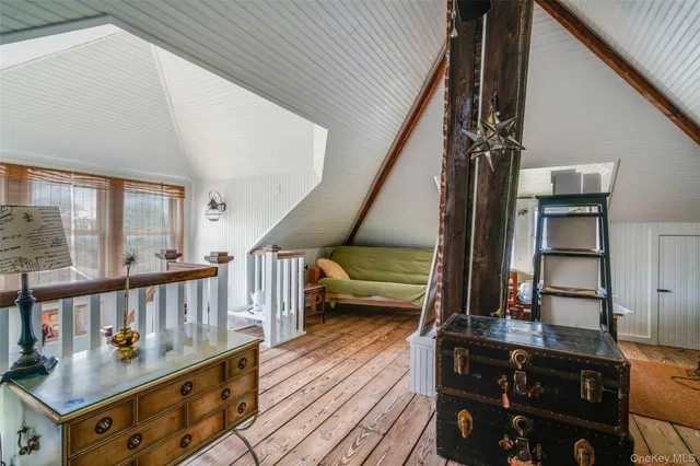 a view of an entryway wooden floor and seating
