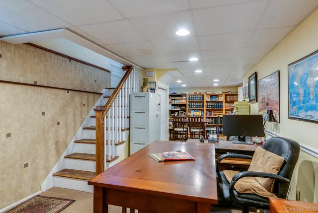 a view of a livingroom with furniture and natural light
