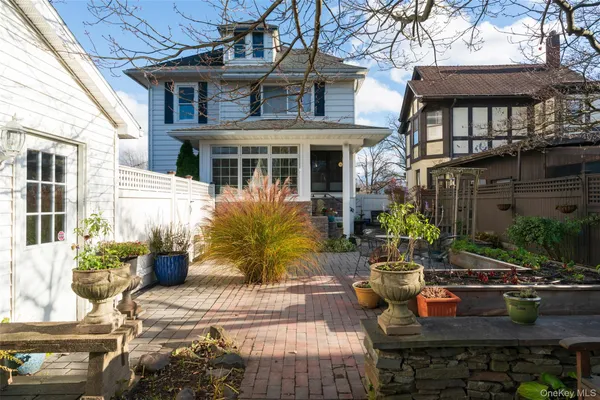 a outdoor space with lots of potted plants
