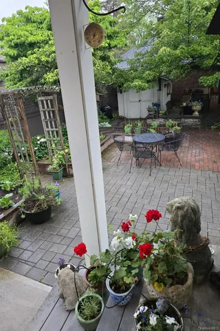 a backyard of a house with lots of green space and a garden