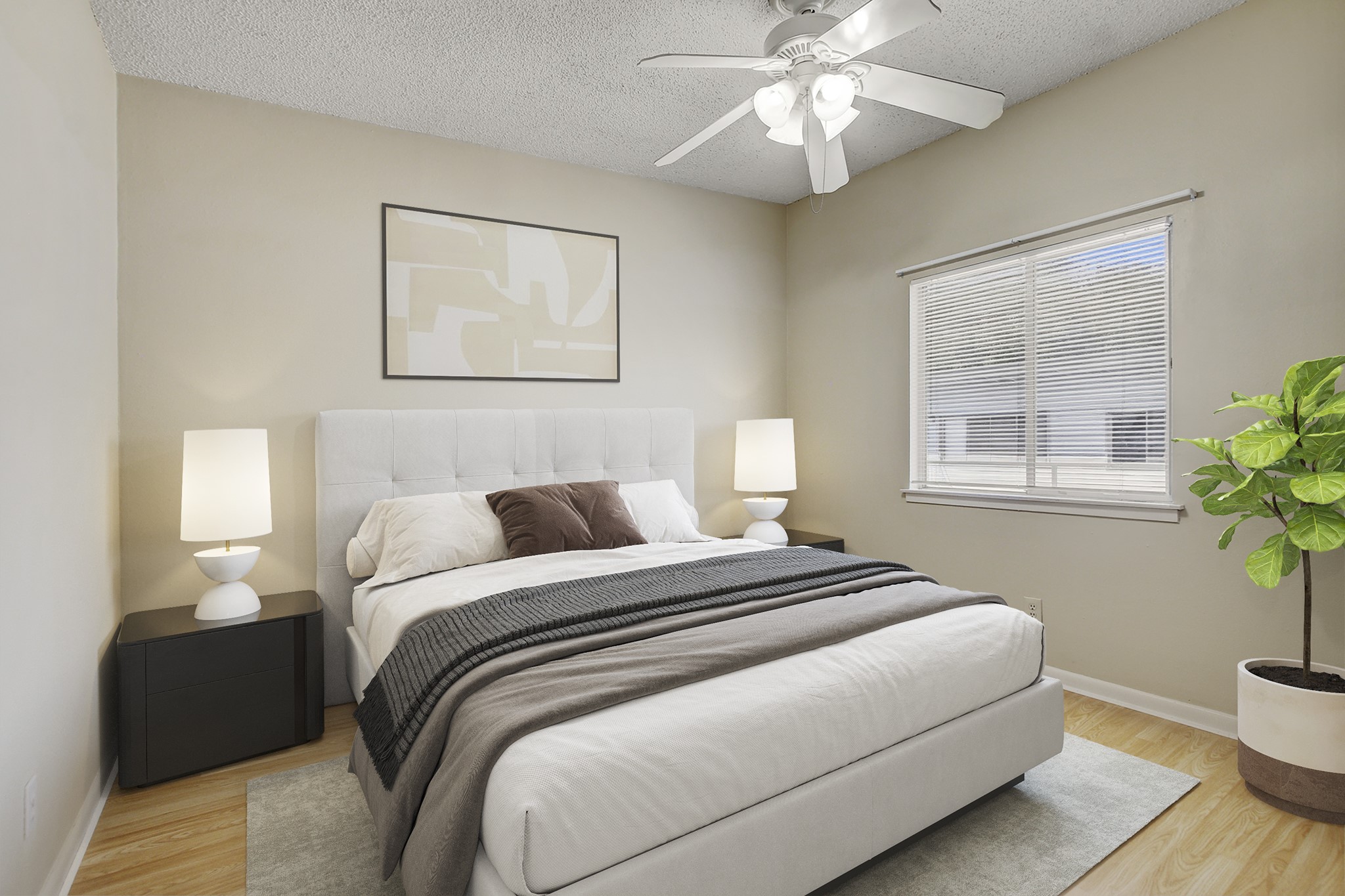 2408 Longview Street, Unit 211 Austin, TX 78705 - Photo 16 of 23 Bedroom featuring a textured ceiling, light wood-style flooring, and a ceiling fan