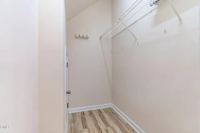 a kitchen with stainless steel appliances a stove microwave and a refrigerator