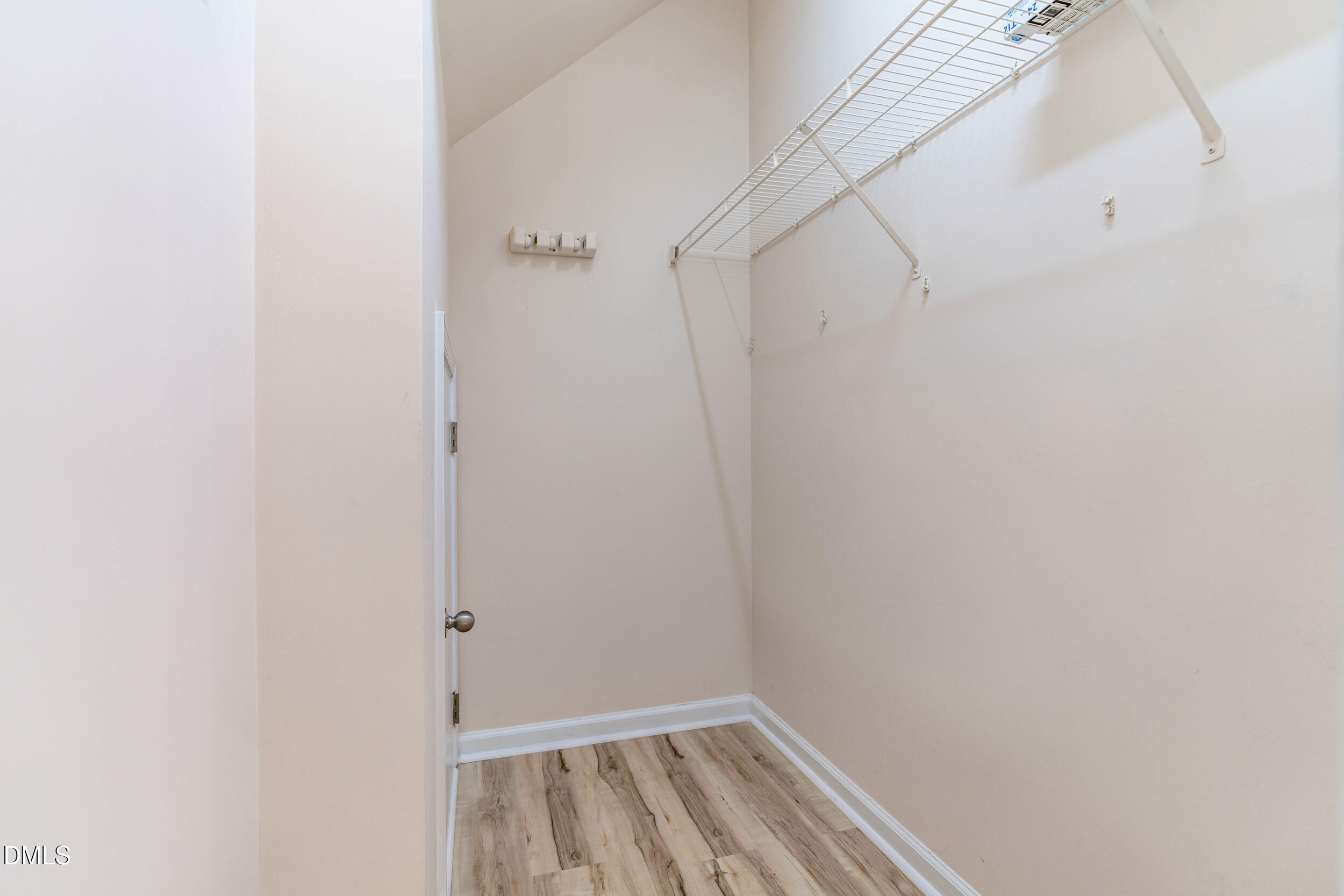 11710 Coppergate Drive, Unit 111 Raleigh, NC 27614 - Photo 8 of 31 a view of a room with racks on the wall