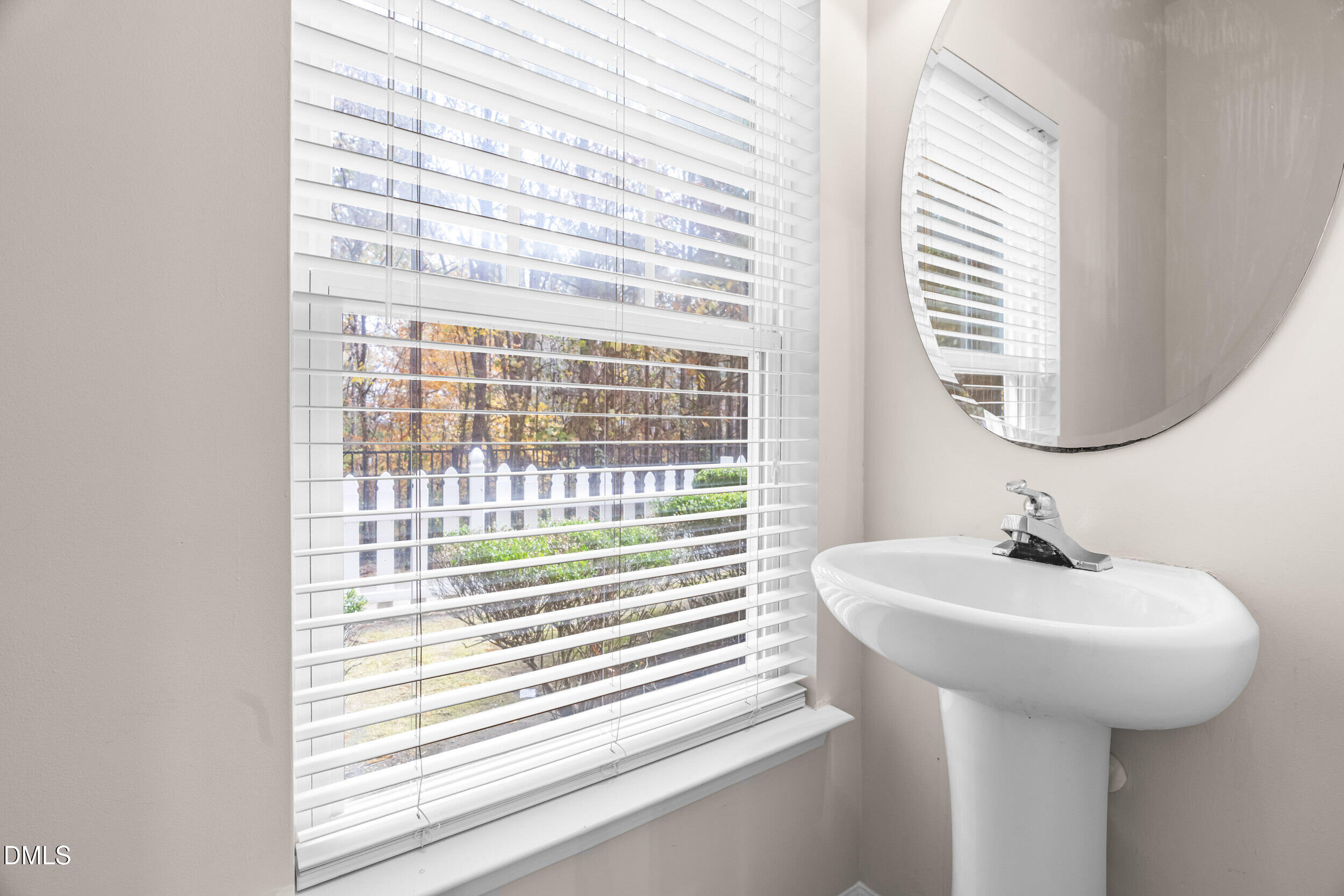 11710 Coppergate Drive, Unit 111 Raleigh, NC 27614 - Photo 9 of 31 a bathroom with a sink and a mirror
