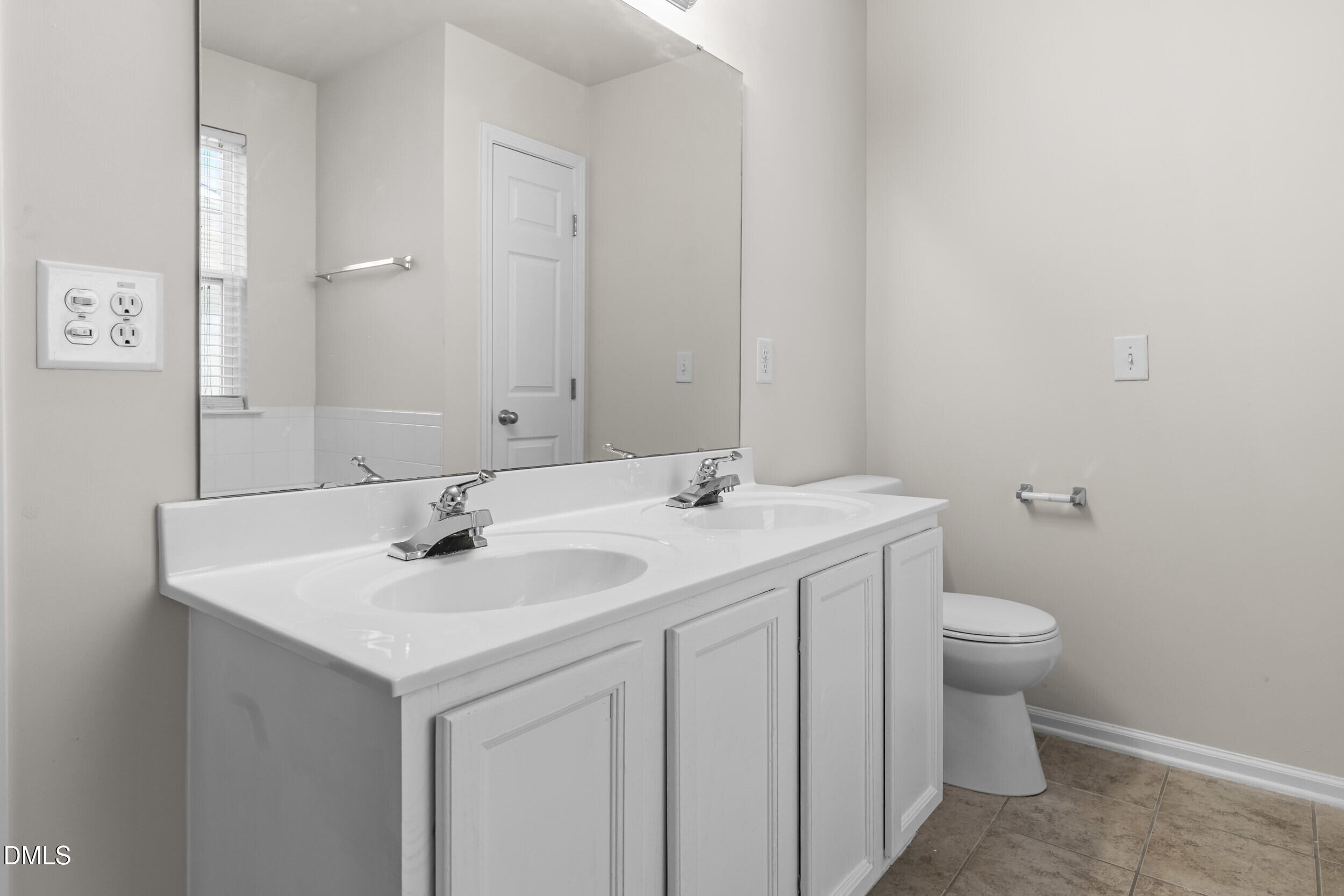 11710 Coppergate Drive, Unit 111 Raleigh, NC 27614 - Photo 13 of 31 a bathroom with a sink and a toilet