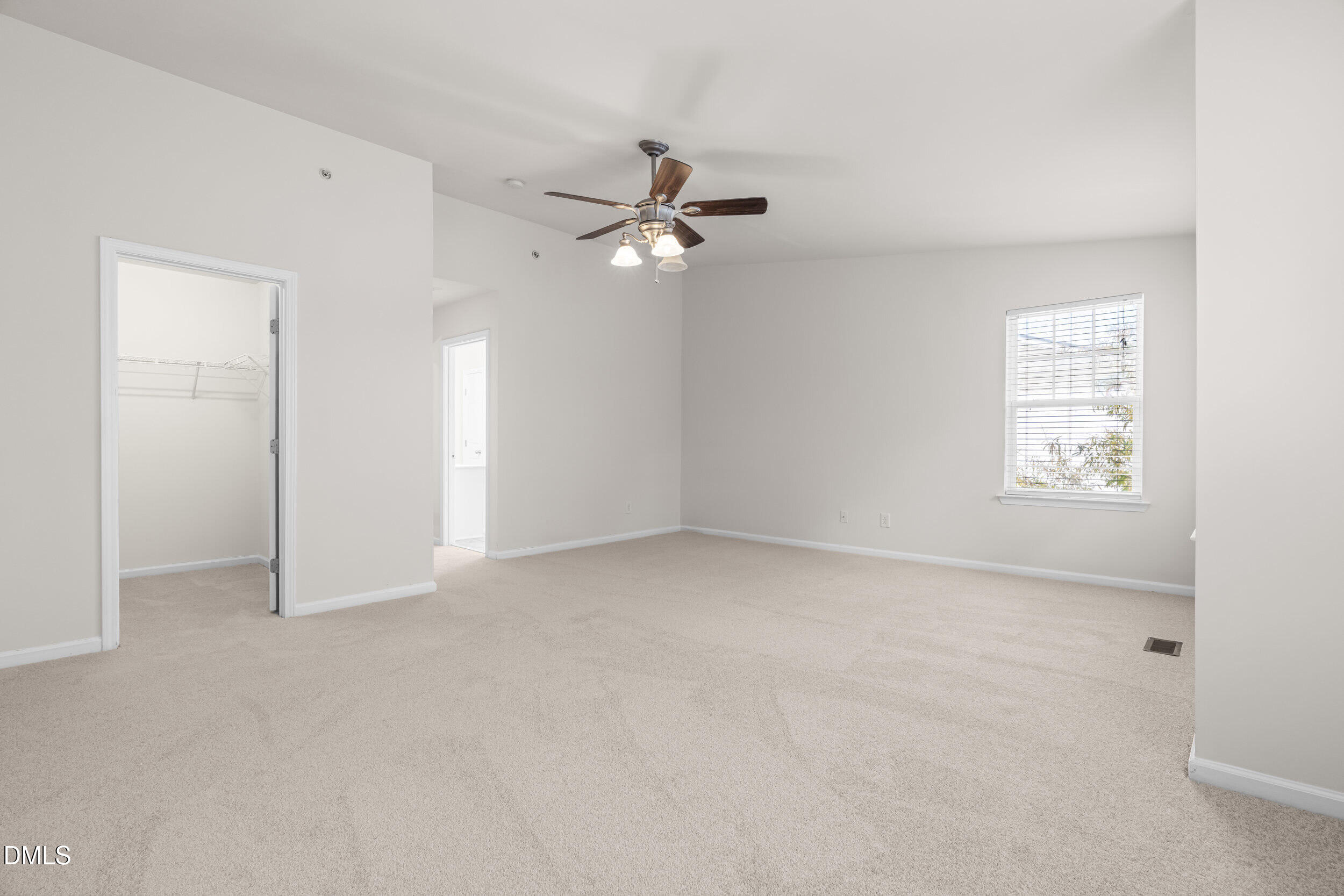 11710 Coppergate Drive, Unit 111 Raleigh, NC 27614 - Photo 15 of 31 an empty room with windows and fan