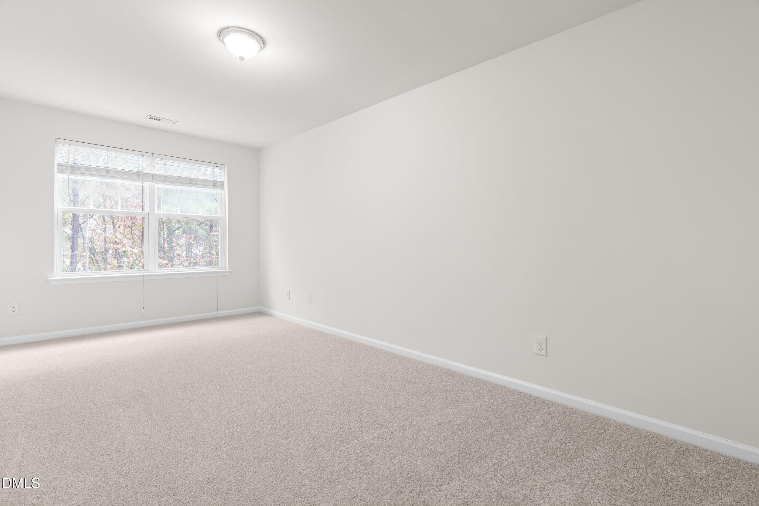 11710 Coppergate Drive, Unit 111 Raleigh, NC 27614 - Photo 16 of 31 an empty room with windows