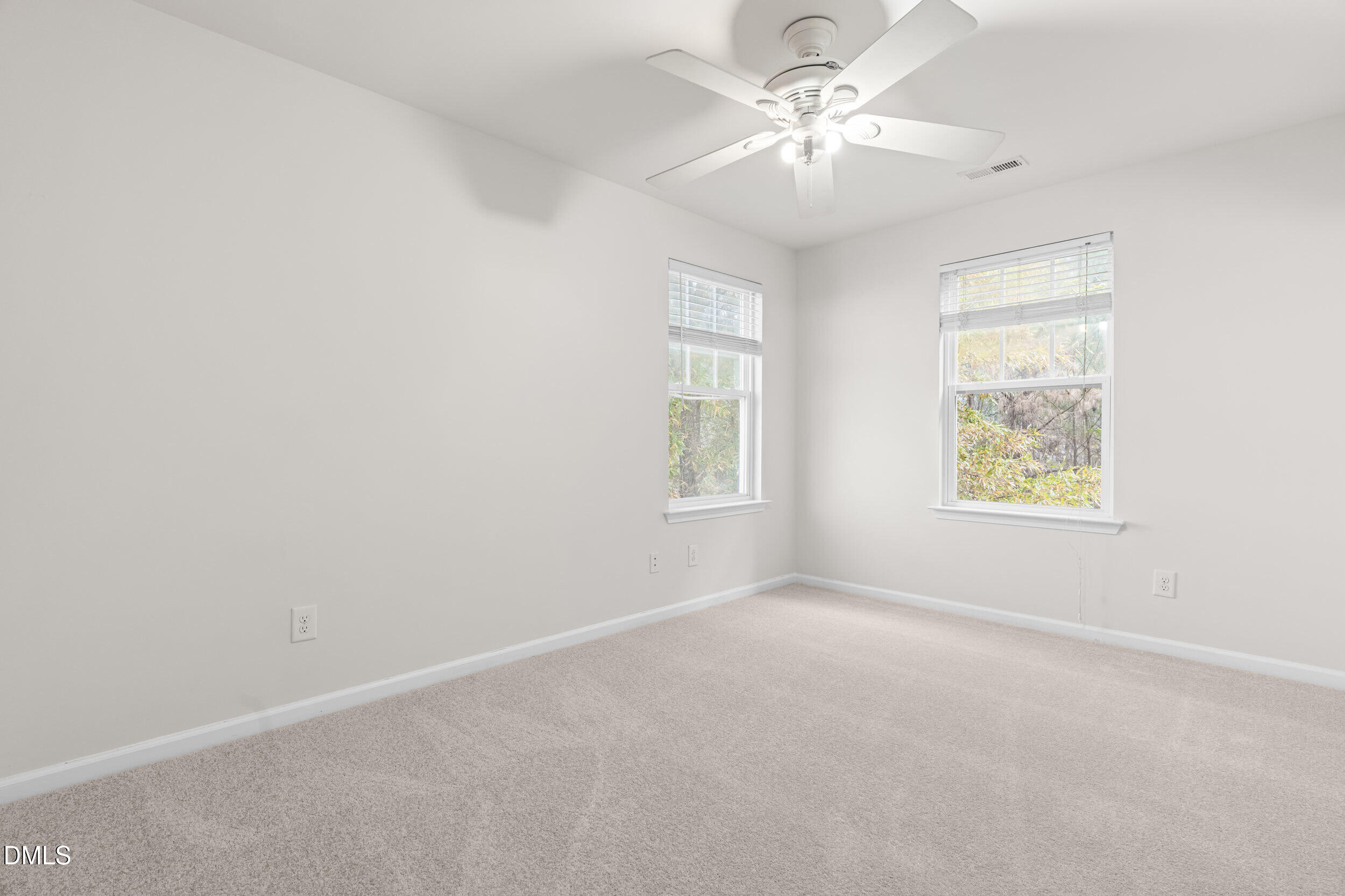 11710 Coppergate Drive, Unit 111 Raleigh, NC 27614 - Photo 17 of 31 an empty room with windows and fan
