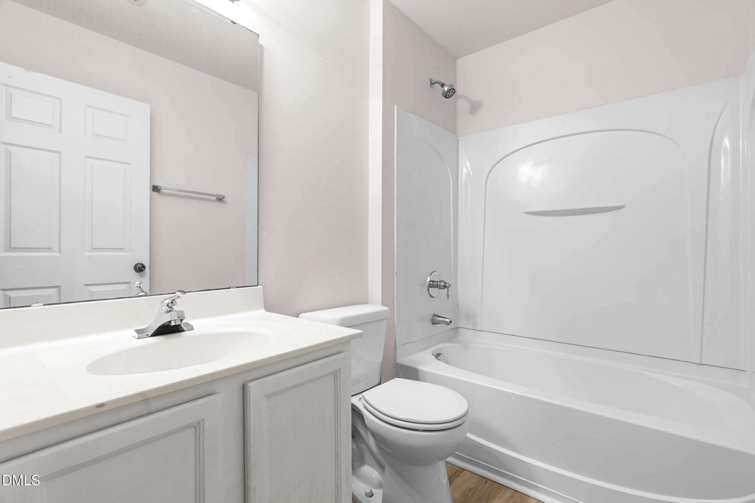 11710 Coppergate Drive, Unit 111 Raleigh, NC 27614 - Photo 18 of 31 a bathroom with a sink a toilet and shower