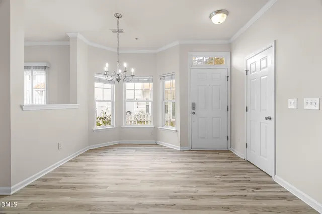 a picture of a room with a white wall and a picture of the side of a wall