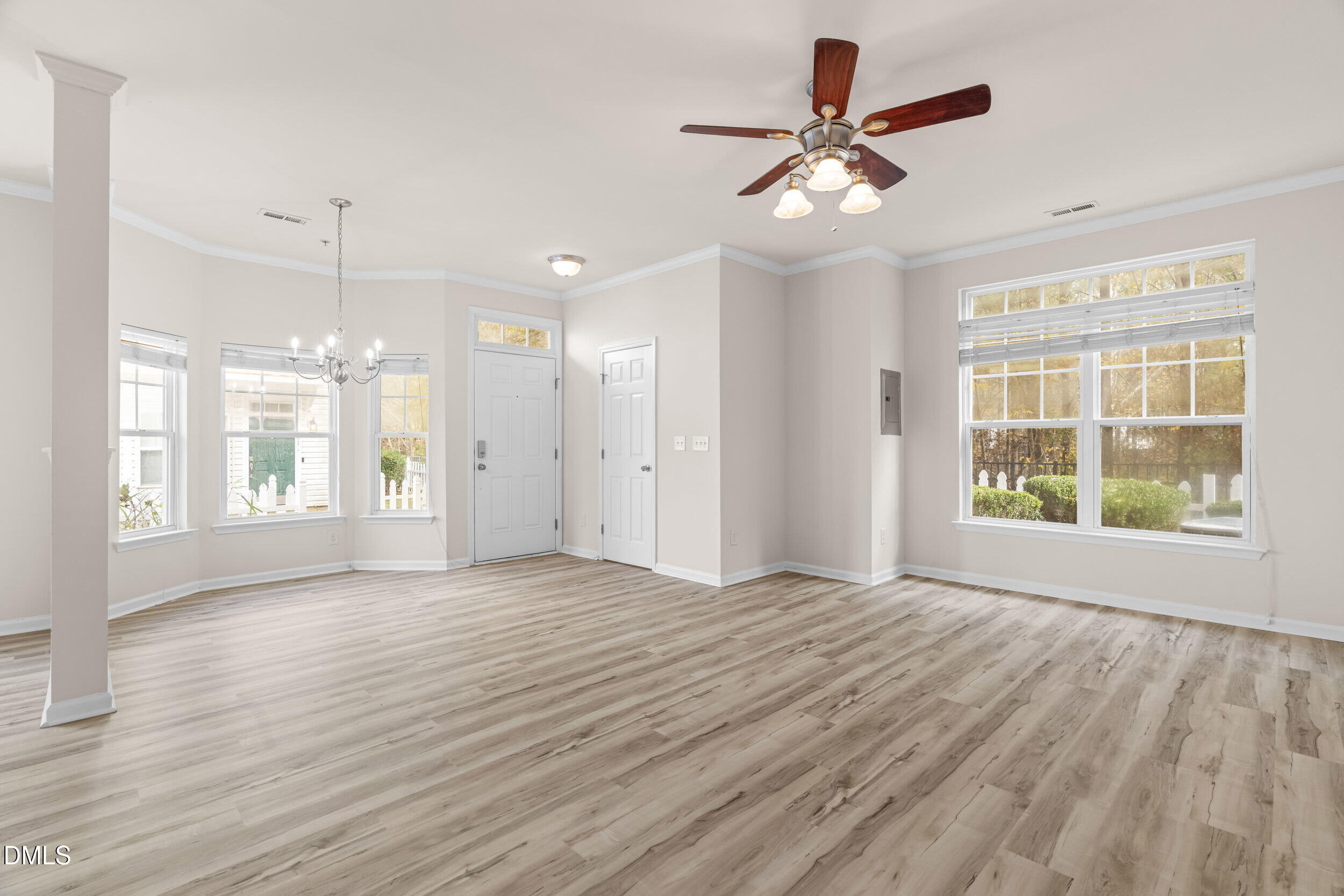 11710 Coppergate Drive, Unit 111 Raleigh, NC 27614 - Photo 3 of 31 a view of an empty room with wooden floor and a window