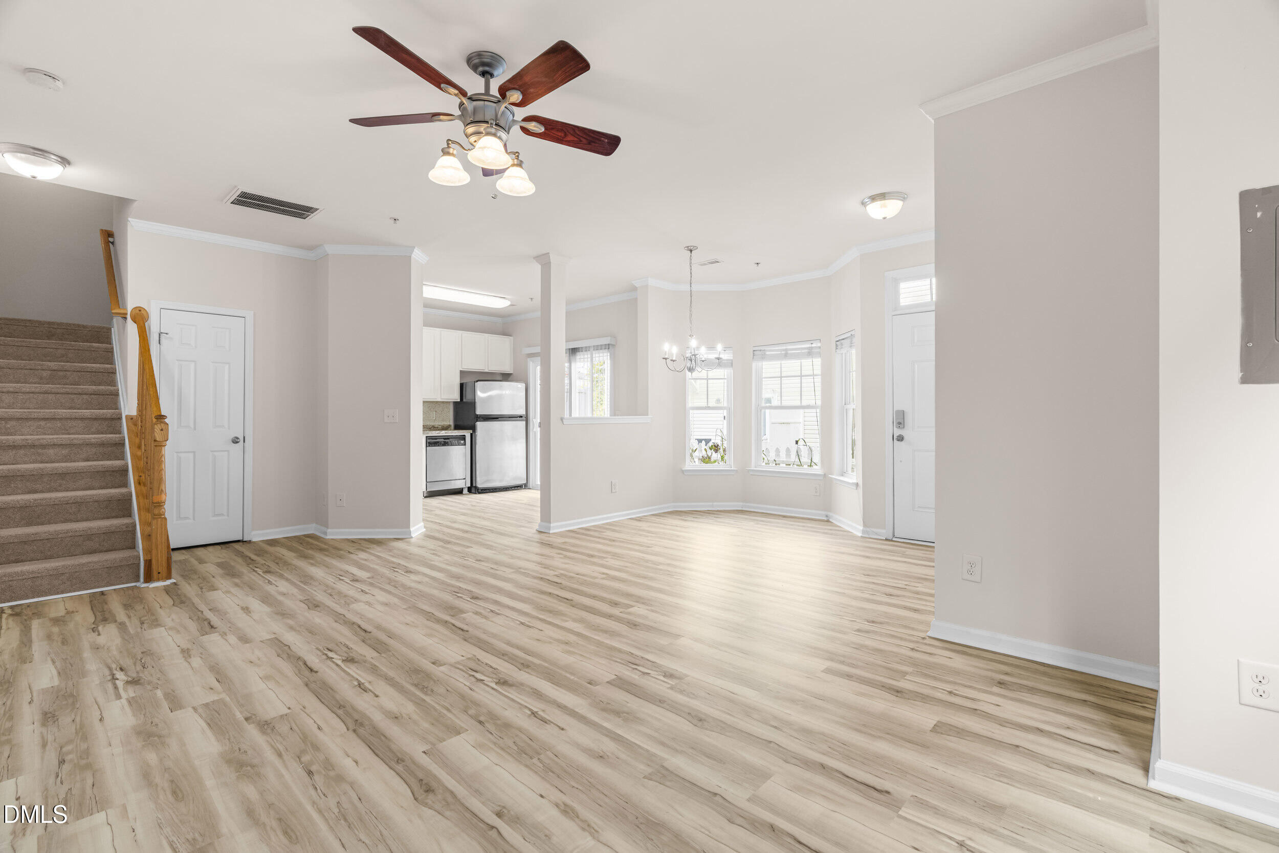 11710 Coppergate Drive, Unit 111 Raleigh, NC 27614 - Photo 4 of 31 a view of an empty room with window and wooden floor