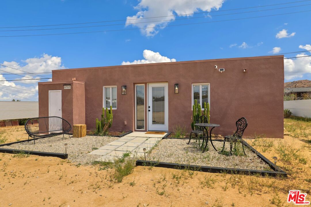 6763 Sunset Road Joshua Tree, CA 92252 - Photo 21 of 31 a view of house with outdoor seating space