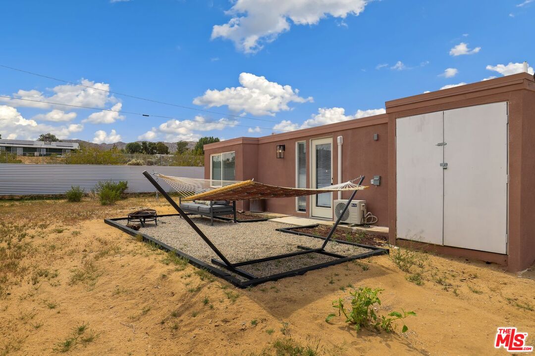 6763 Sunset Road Joshua Tree, CA 92252 - Photo 25 of 31 a view of a terrace with chairs