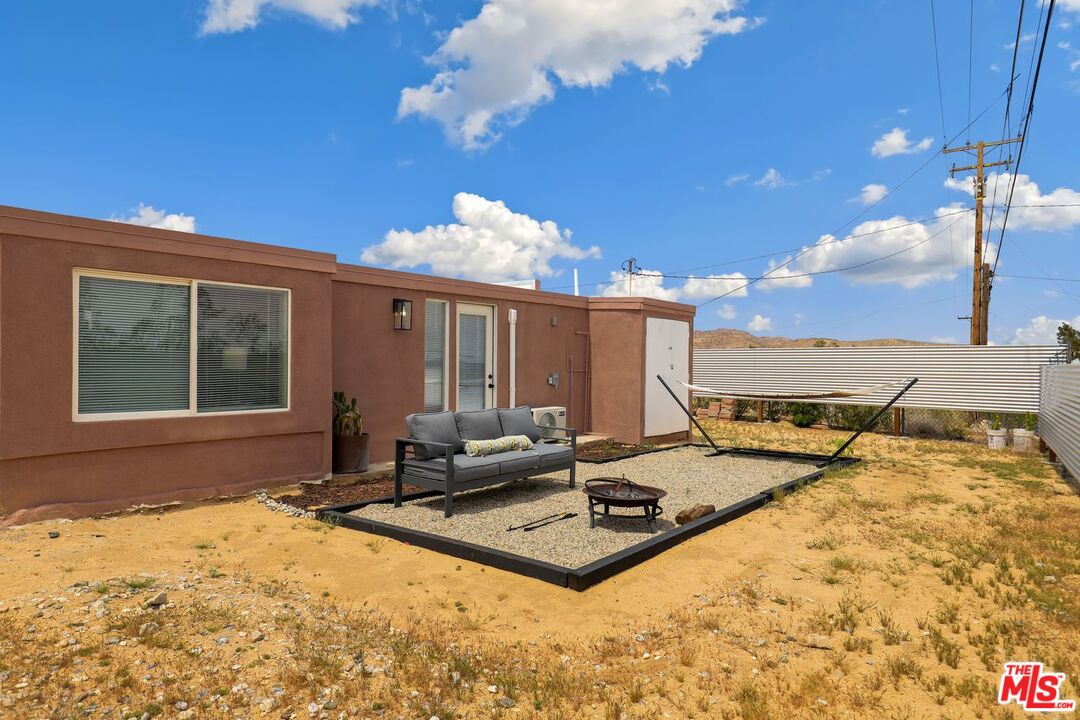 6763 Sunset Road Joshua Tree, CA 92252 - Photo 28 of 31 a view of a swimming pool with a lounge chairs