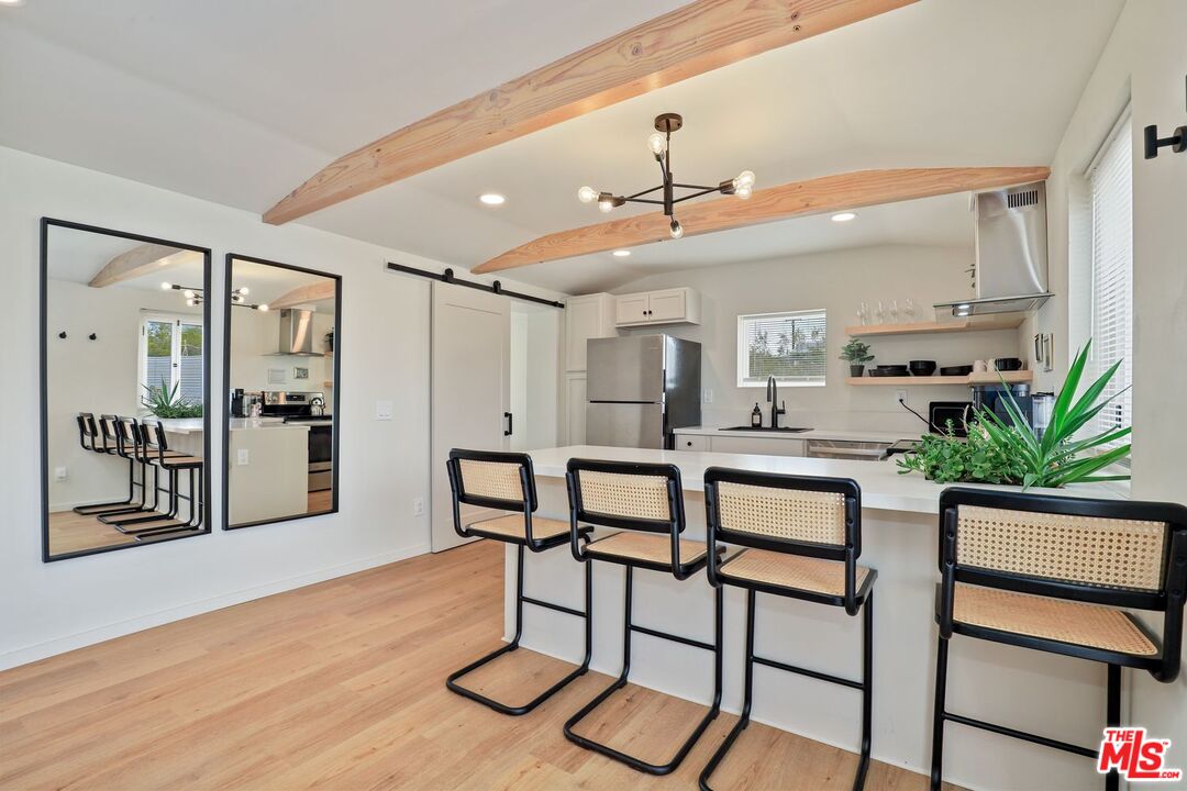 6763 Sunset Road Joshua Tree, CA 92252 - Photo 8 of 31 a dining room with furniture and window