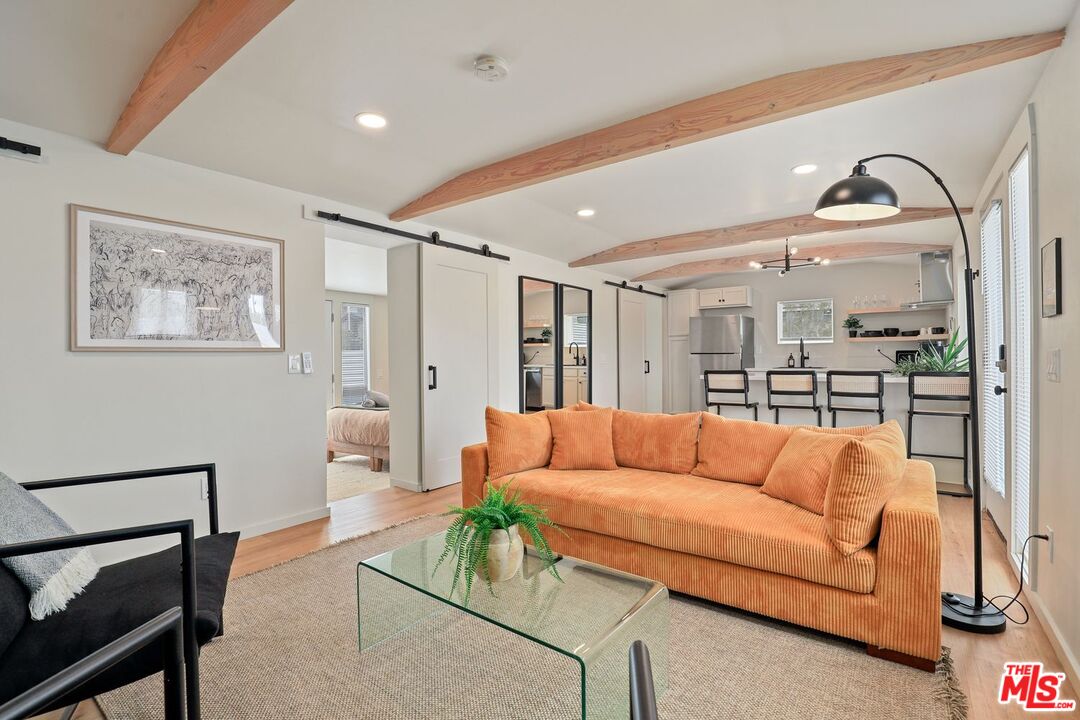 6763 Sunset Road Joshua Tree, CA 92252 - Photo 9 of 31 a living room with furniture and a flat screen tv