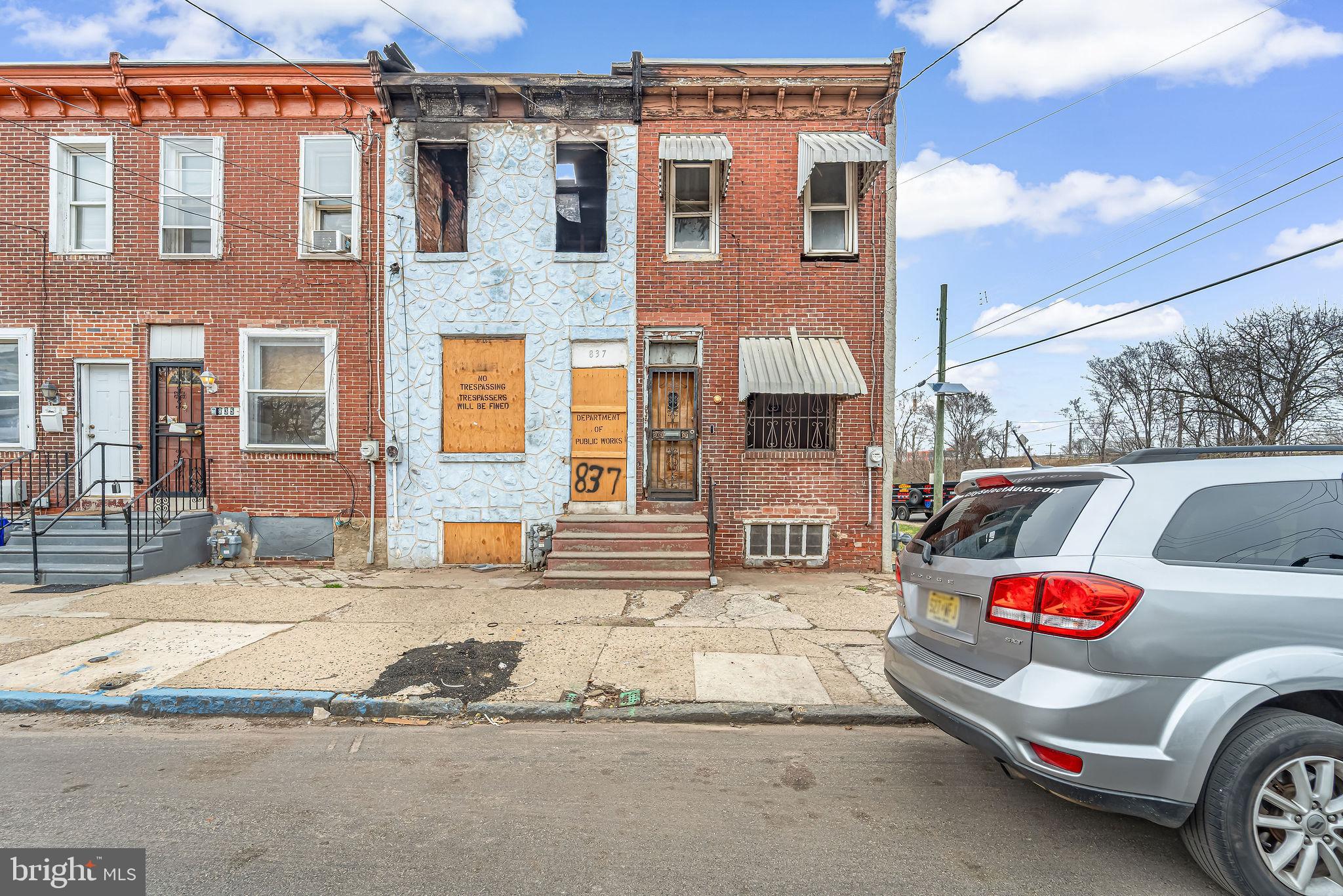 839 Spruce Street Camden, NJ 08103 - Photo 1 of 15 a building with car parked in front of it
