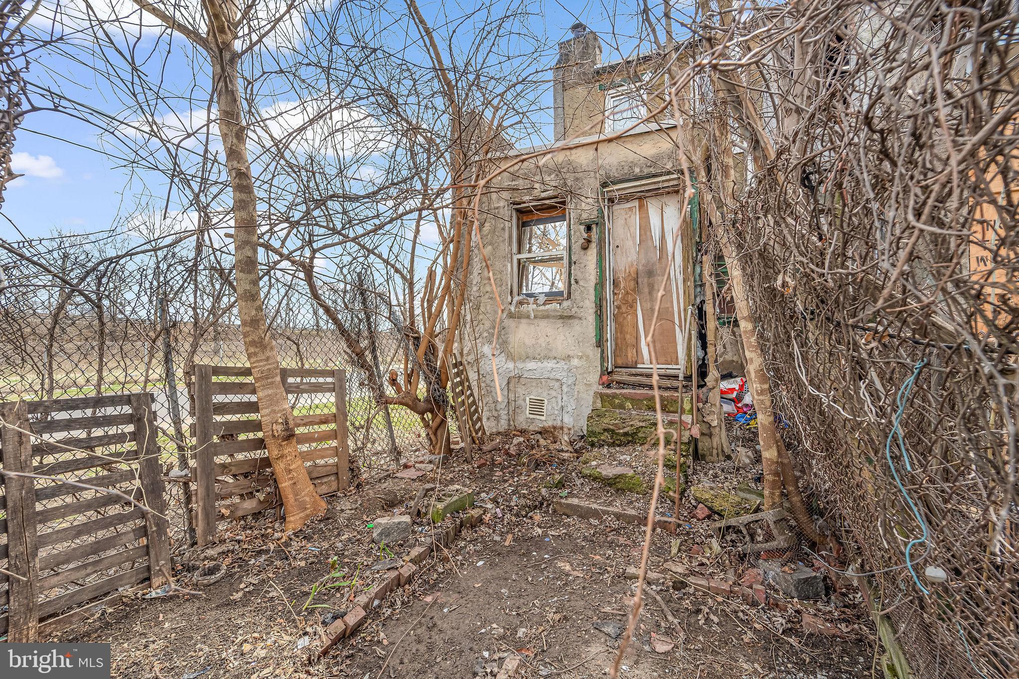 839 Spruce Street Camden, NJ 08103 - Photo 15 of 15 a view of a house with a yard and wooden fence