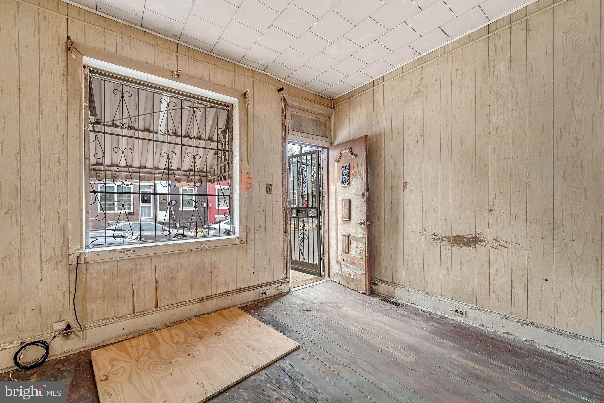 839 Spruce Street Camden, NJ 08103 - Photo 5 of 15 an empty room with windows