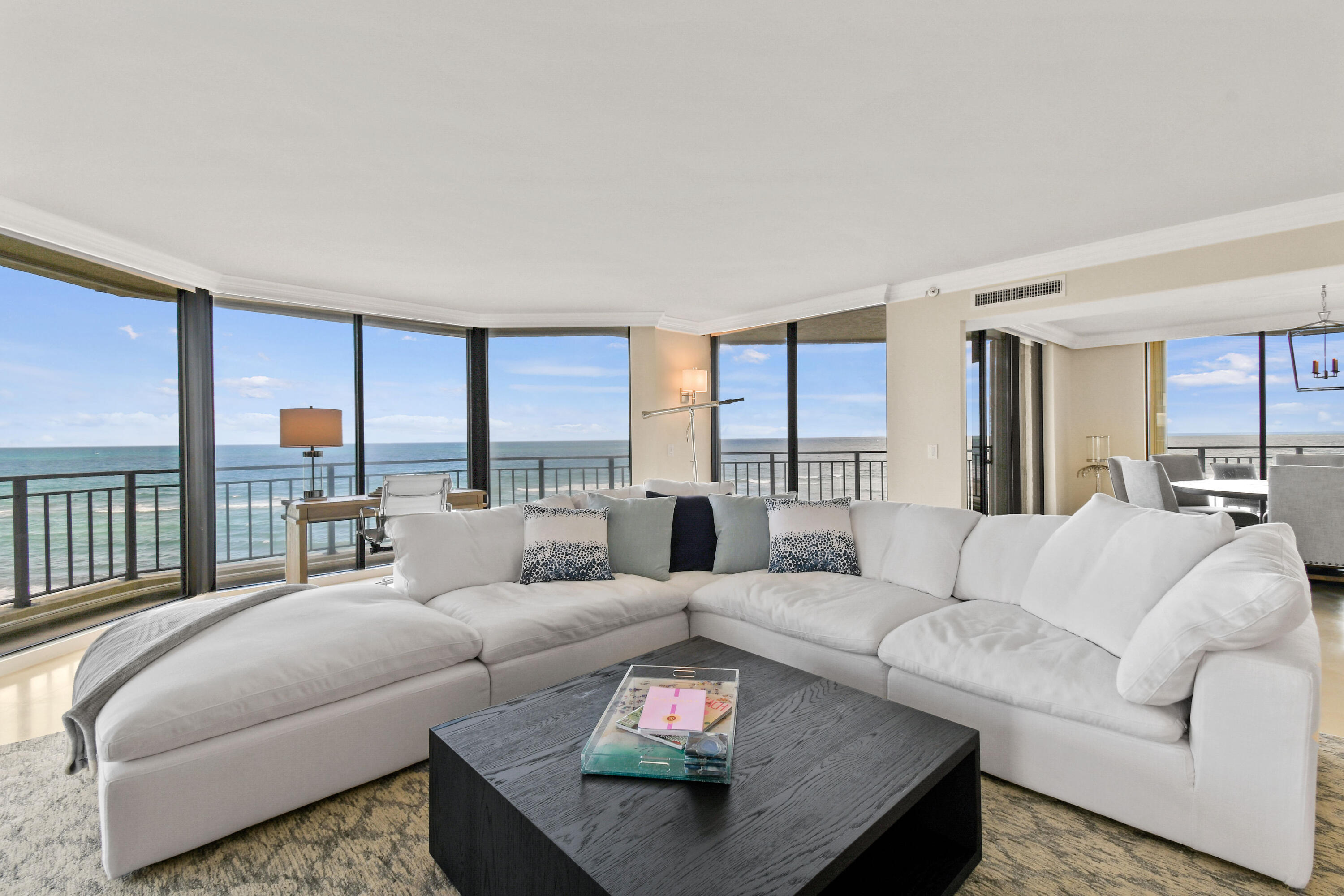 19850 South Beach Road, Unit 5A Jupiter, FL 33469 - Photo 12 of 78 a living room with furniture and a large window