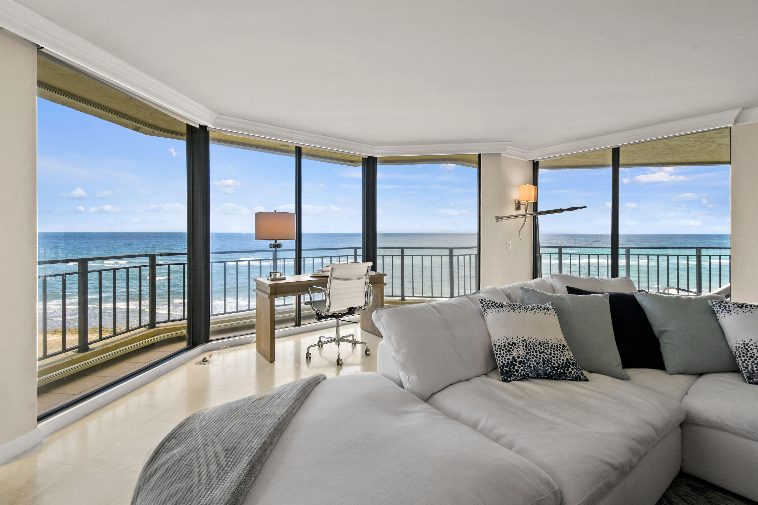 19850 South Beach Road, Unit 5A Jupiter, FL 33469 - Photo 13 of 78 a large bedroom with a large bed and a balcony