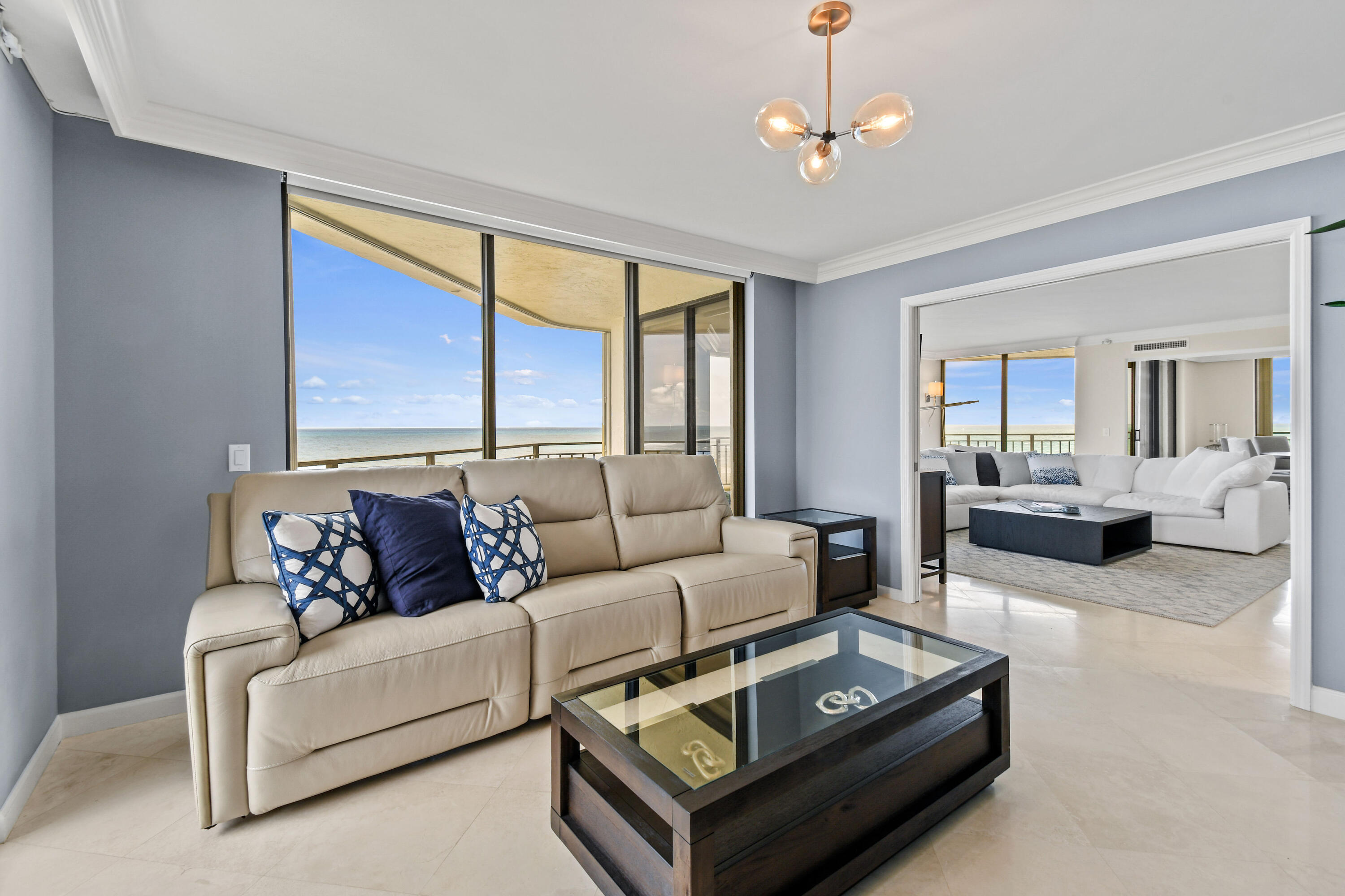 19850 South Beach Road, Unit 5A Jupiter, FL 33469 - Photo 20 of 78 a living room with furniture and a large window