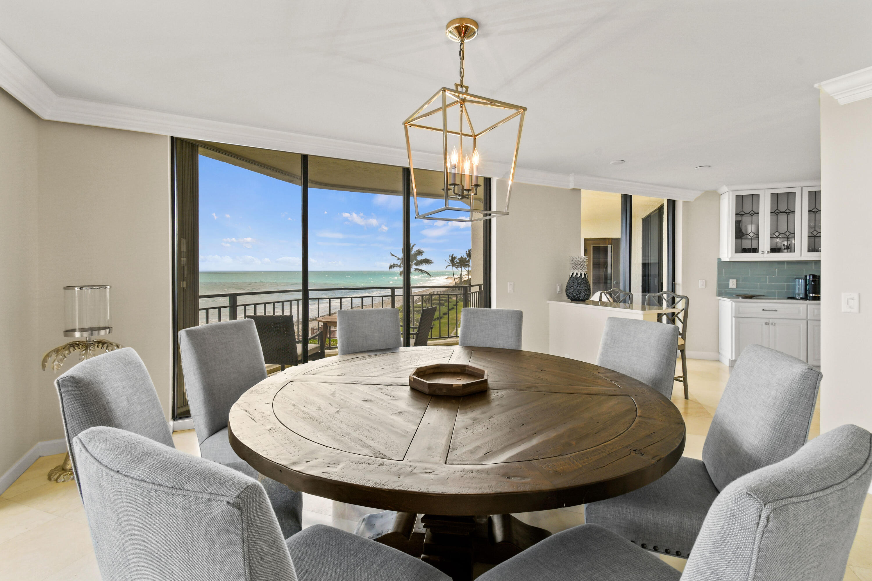 19850 South Beach Road, Unit 5A Jupiter, FL 33469 - Photo 23 of 78 a dining room with furniture and window