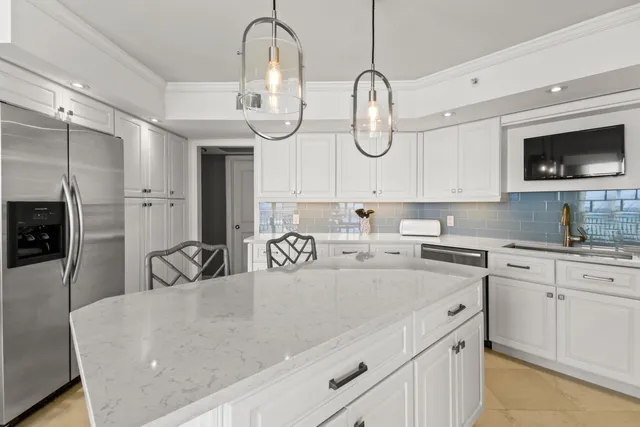 a spacious bathroom with a granite countertop sink mirror and cabinets