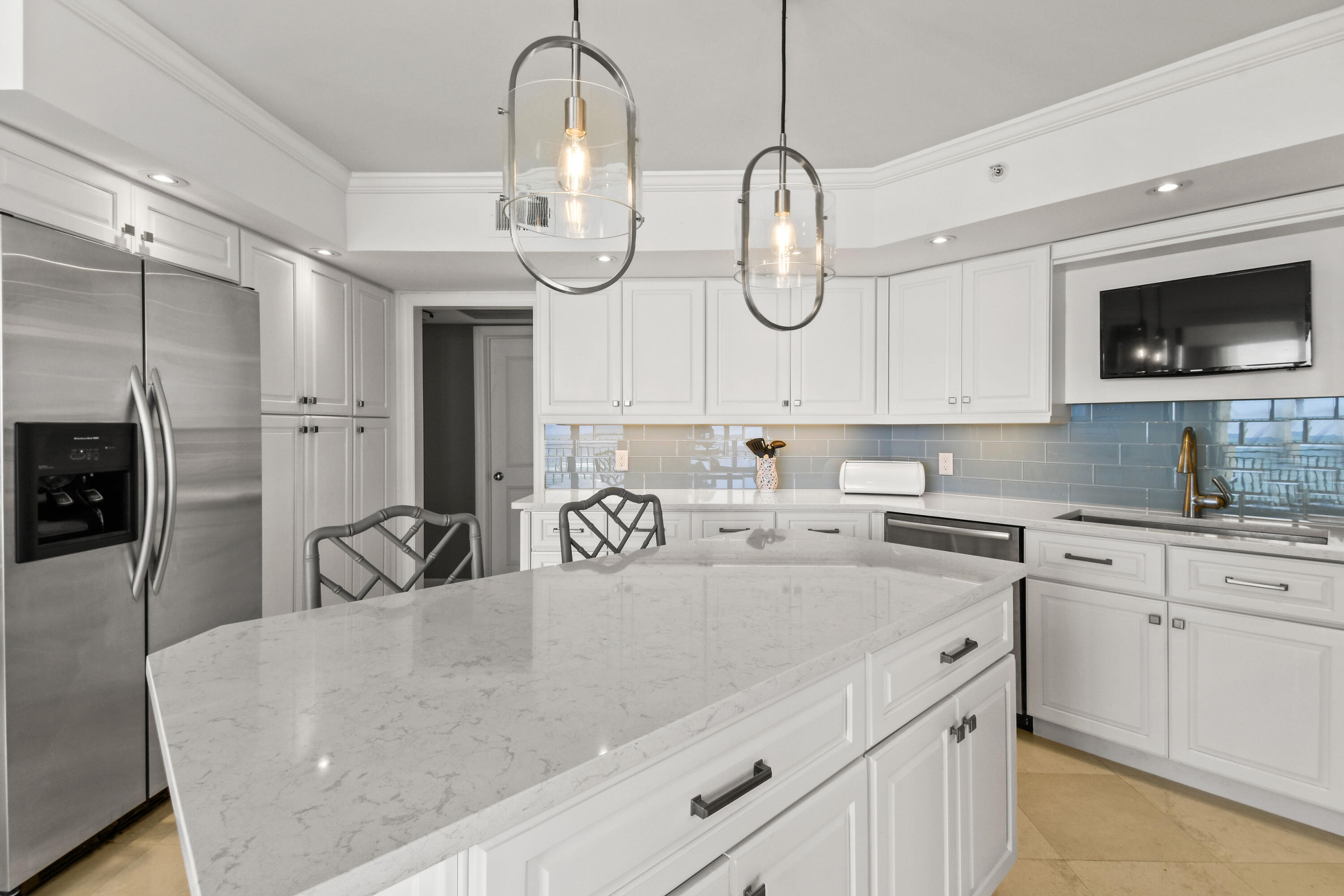 19850 South Beach Road, Unit 5A Jupiter, FL 33469 - Photo 30 of 78 a kitchen with cabinets a sink and appliances