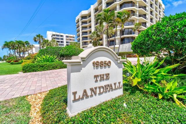 a living room with furniture large window and glass table
