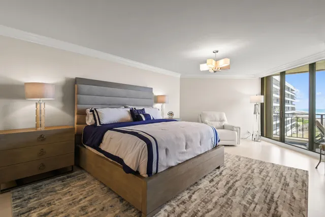 a bedroom with a bed and a chair