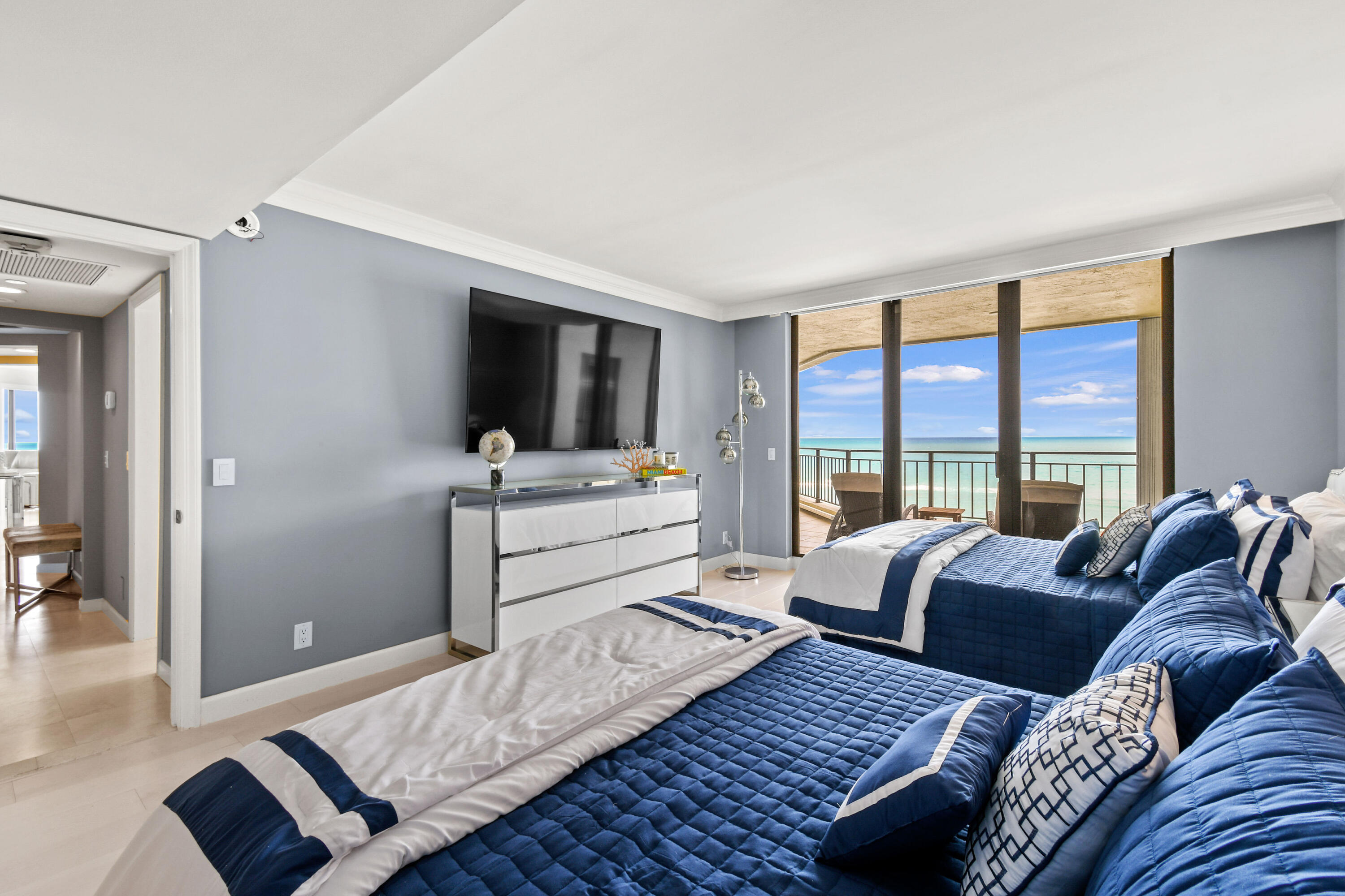 19850 South Beach Road, Unit 5A Jupiter, FL 33469 - Photo 46 of 78 a bedroom with furniture and a large window