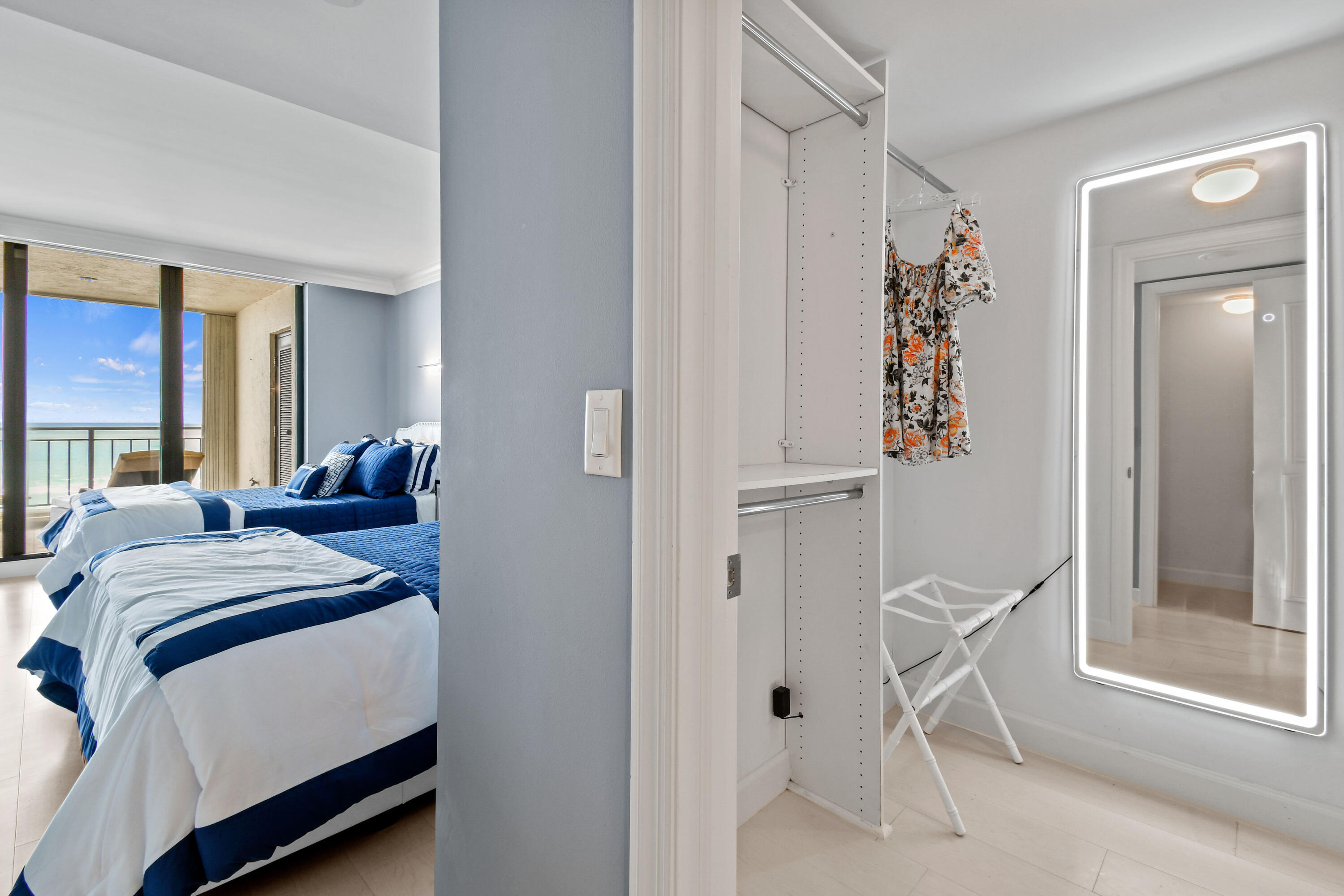 19850 South Beach Road, Unit 5A Jupiter, FL 33469 - Photo 49 of 78 a bedroom with a bed and a chair