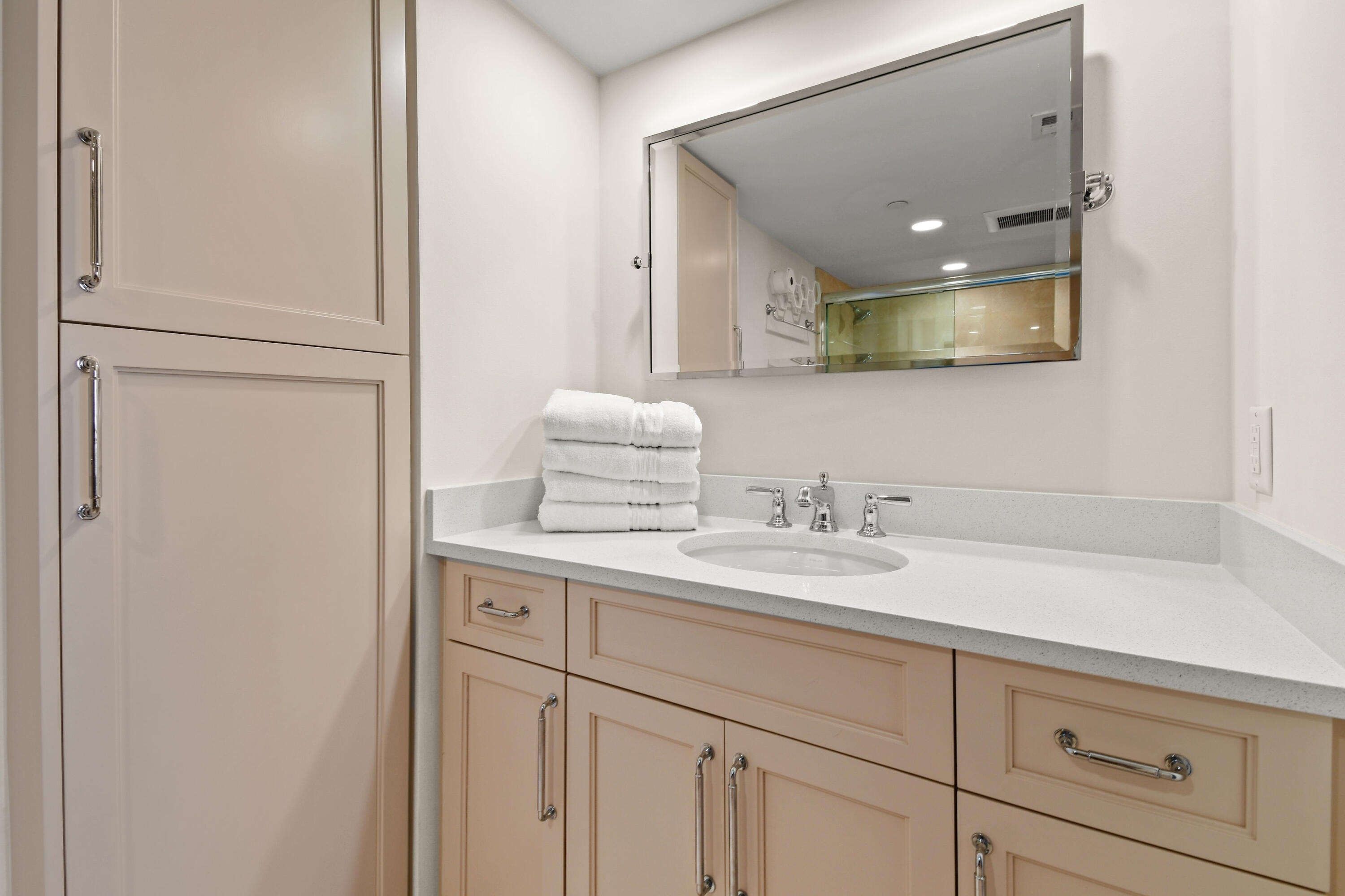 19850 South Beach Road, Unit 5A Jupiter, FL 33469 - Photo 50 of 78 a bathroom with a sink and a mirror