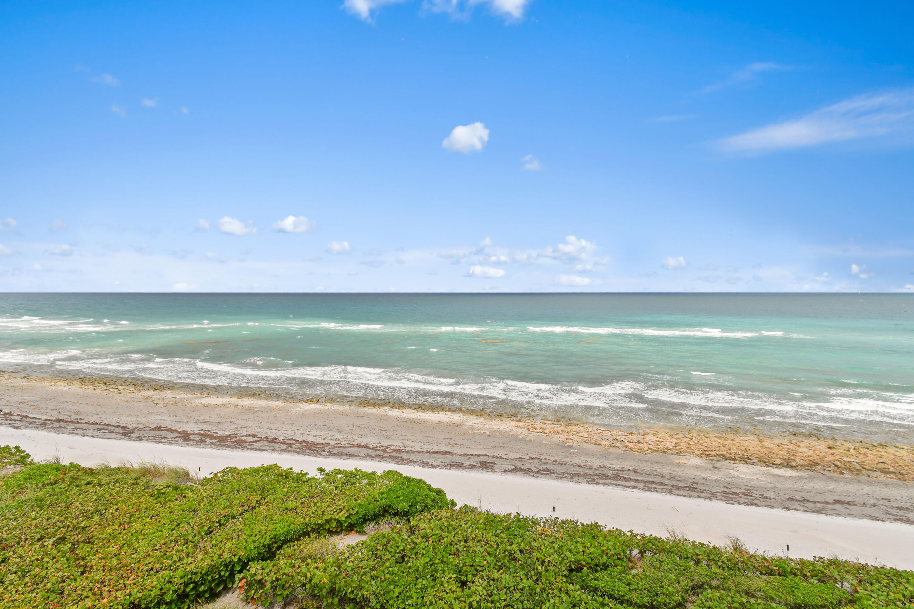 19850 South Beach Road, Unit 5A Jupiter, FL 33469 - Photo 61 of 78 a view of an ocean and a beach