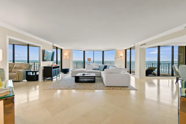 a large bedroom with a large bed and a balcony