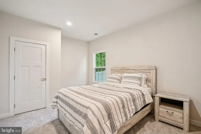 a bedroom with a bed and a cabinets