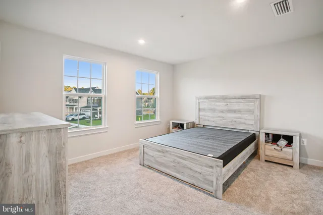 a bedroom with a bed and a stove